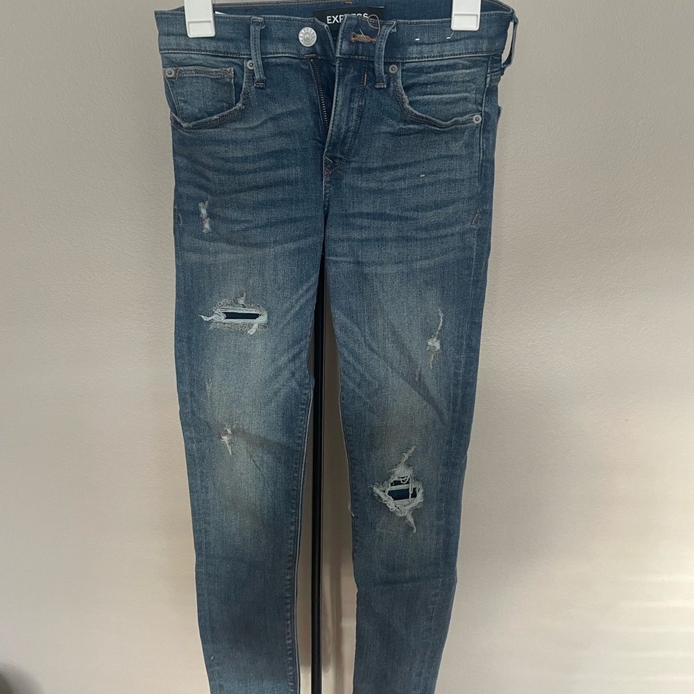 Express Mid Rise Blue Jeans with covered holes, Skinny leg size 0! Very stretchy